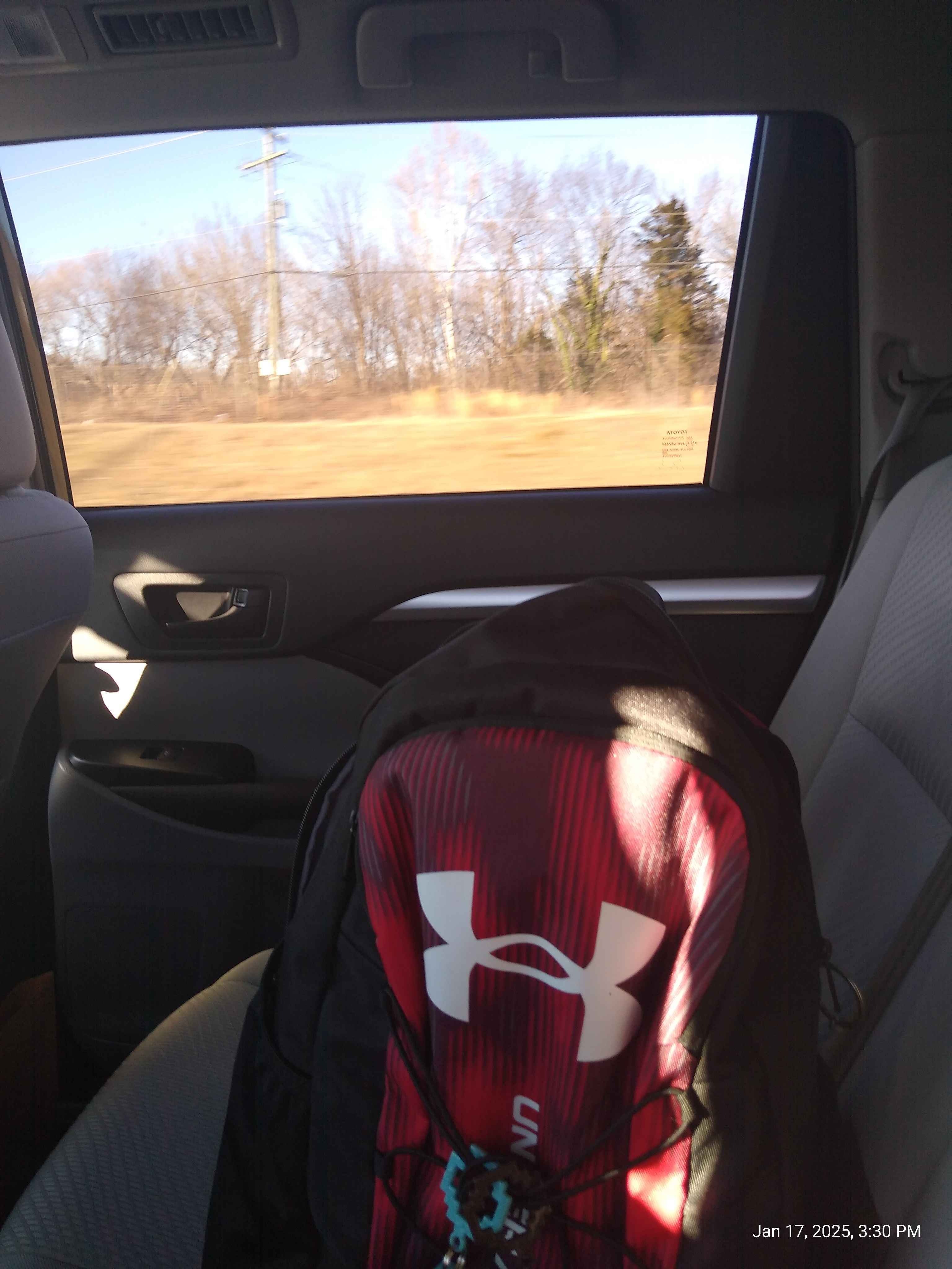 under armor book bag with four small pockets and one big pocket with water bottle holder