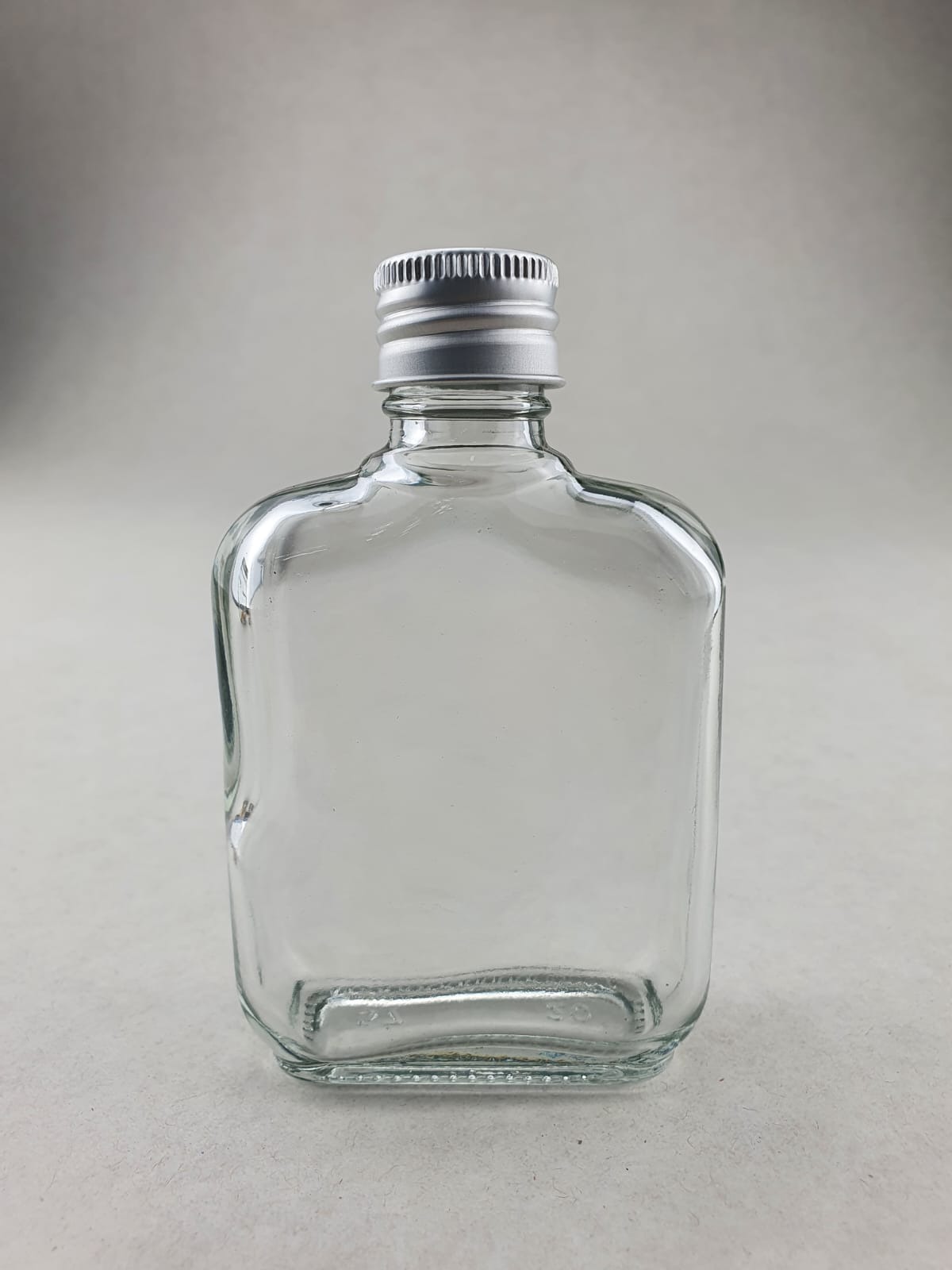 Buy 85ml Clear Square Bottle with Silver Cap & Stp online at Medtra