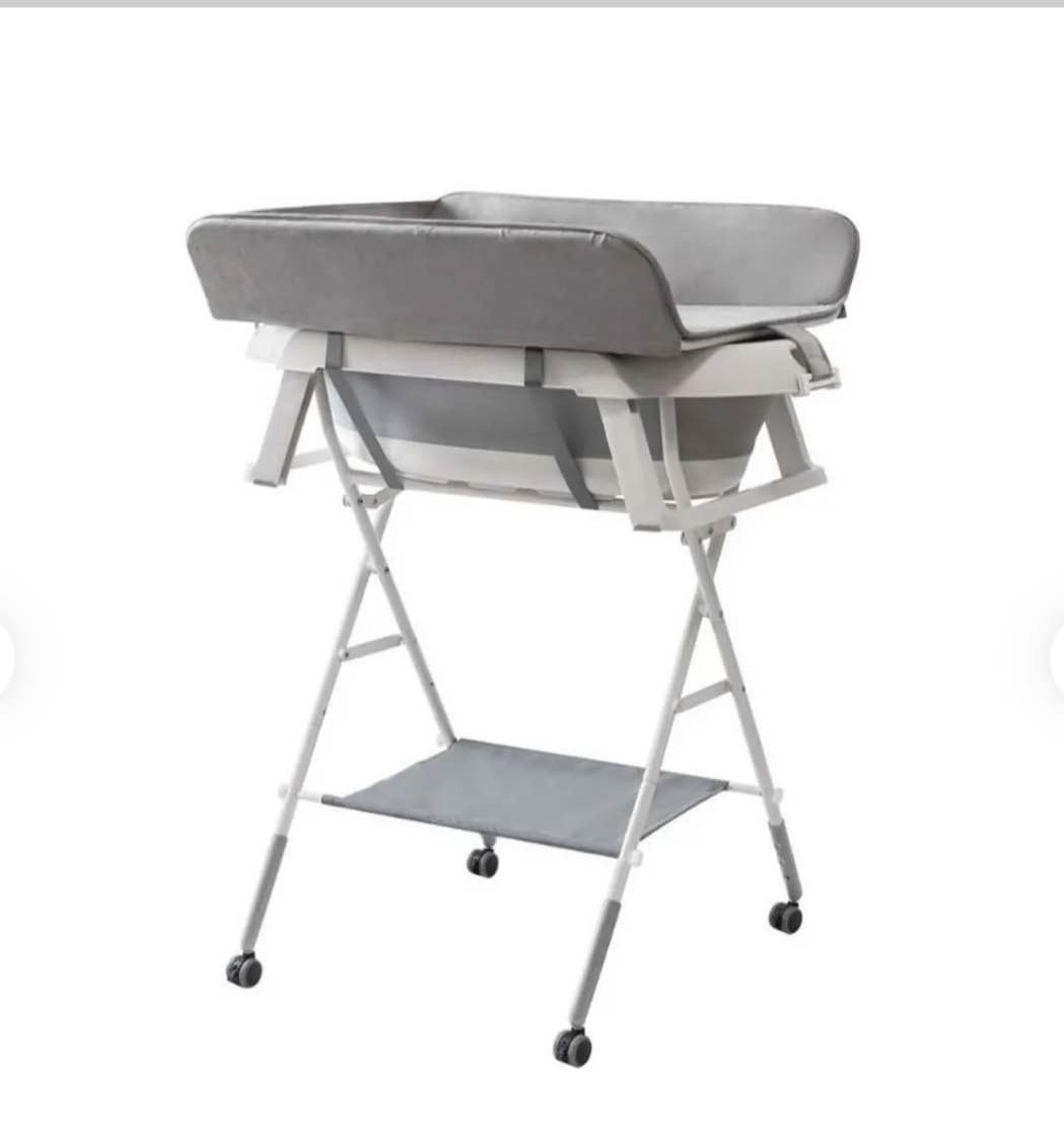 changing table and bath tub