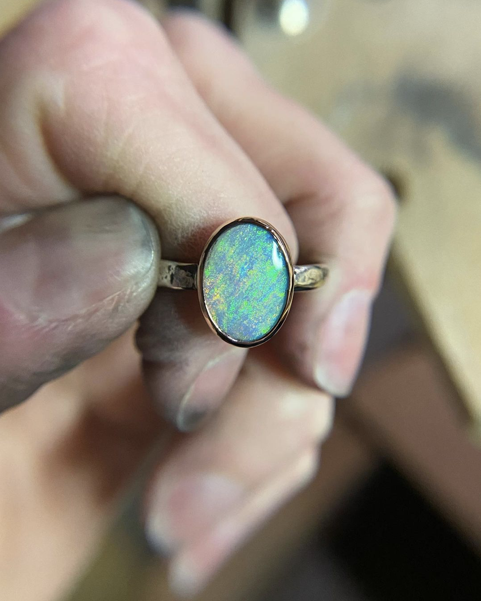 wildpreciousjewelry Messy bench shots with beautifully polished jewelry is where it’s at right now, folks.   What does this opal remind you of!?